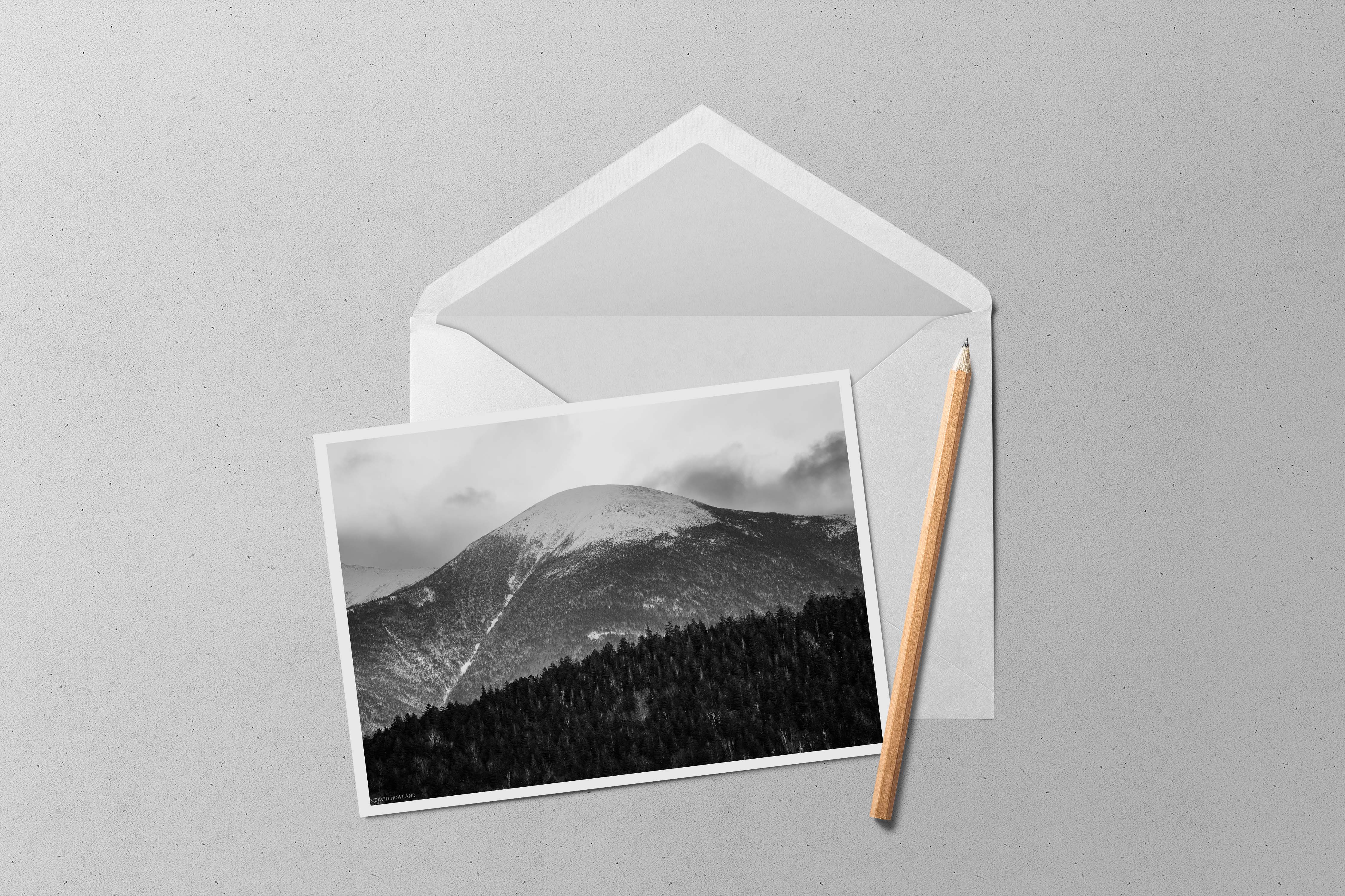 A black and white photo of snow-covered Mount Eisenhower in the Presidential mountain range of New Hampshire.