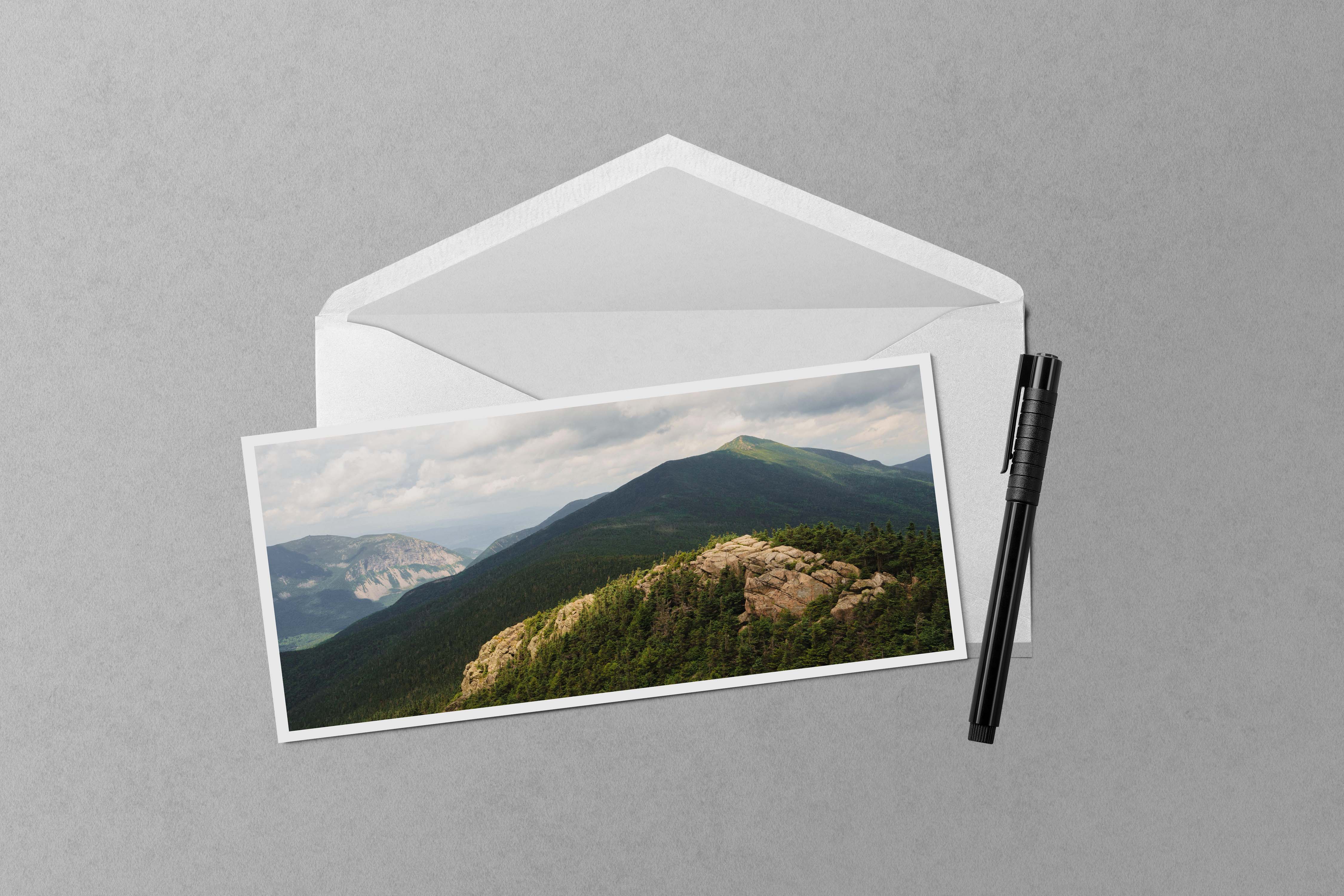 A panorama photo of the summits of Mount Lincoln, Cannon Mountain, and Little Haystack in Franconia Notch in the White Mountains of New Hampshire